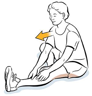Seated woman doing hamstring stretch.