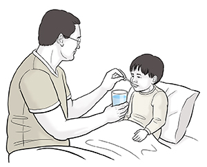 Papá dándole agua a cucharadas a su hijo enfermo en cama.